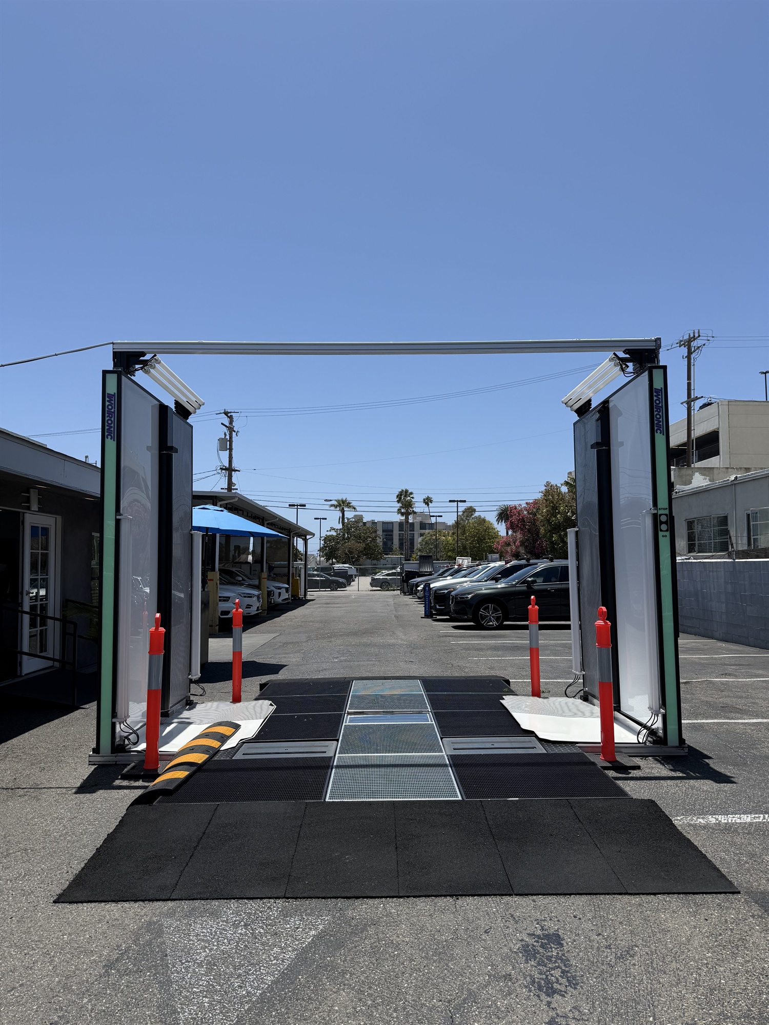Looking through the outdoor scanning gate, with the in-floor glass scanner plates visible in the lane