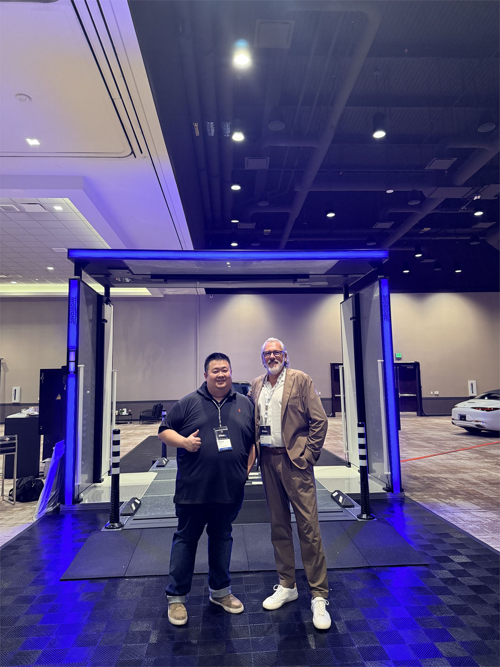 RhinoCap founder Oscar Tseng with a TwoTronic colleague in front of the XVD at NDTD 2026