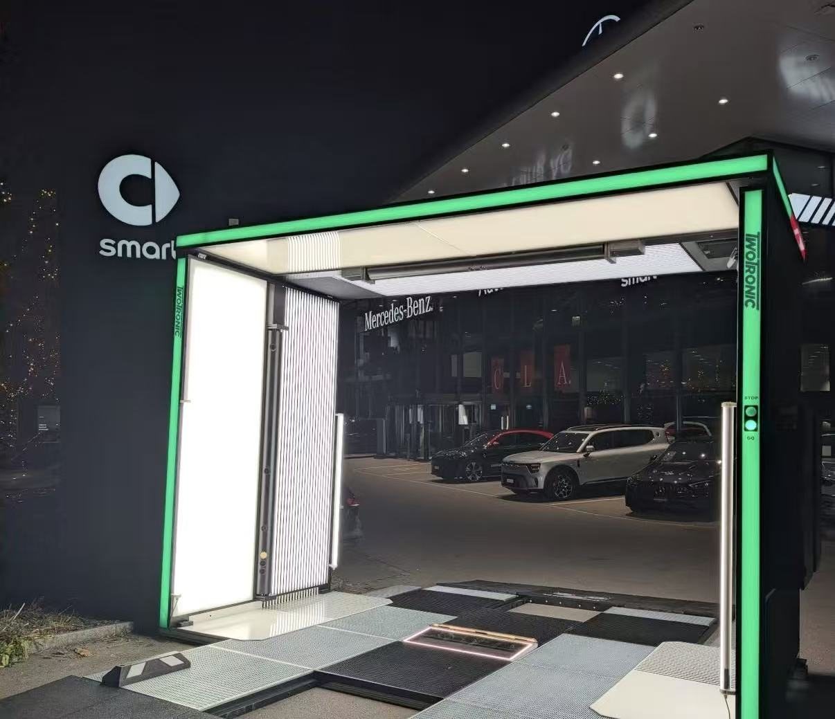 Scanner illuminated at night on a dealership forecourt