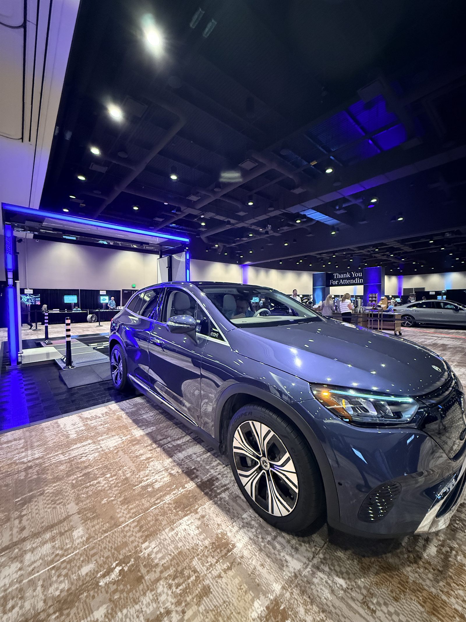 Electric SUV parked beside the illuminated scanning gate